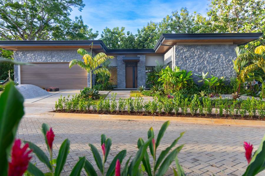 Tropical planting filling in around a finished home